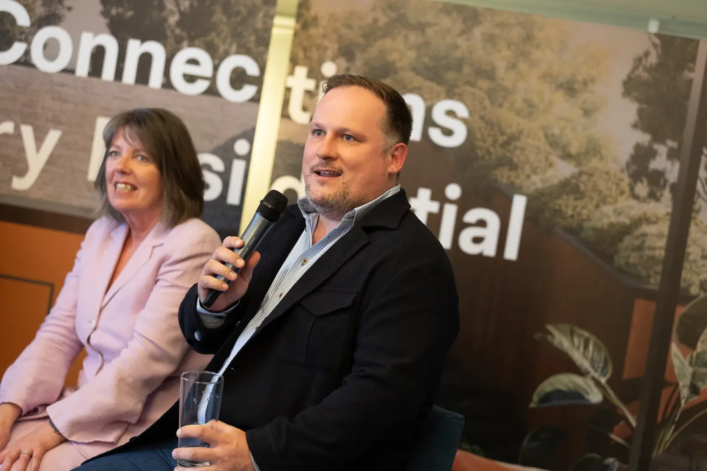 Dominic Murphy speaking at a property event